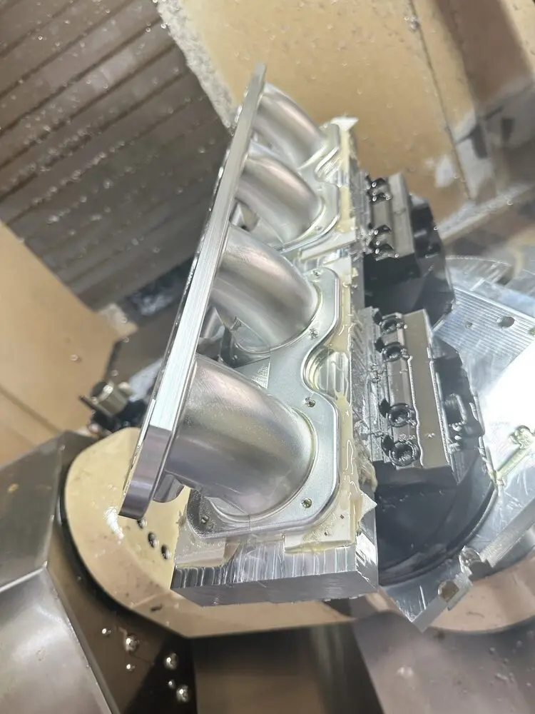 Deep curved-port machining in aluminum