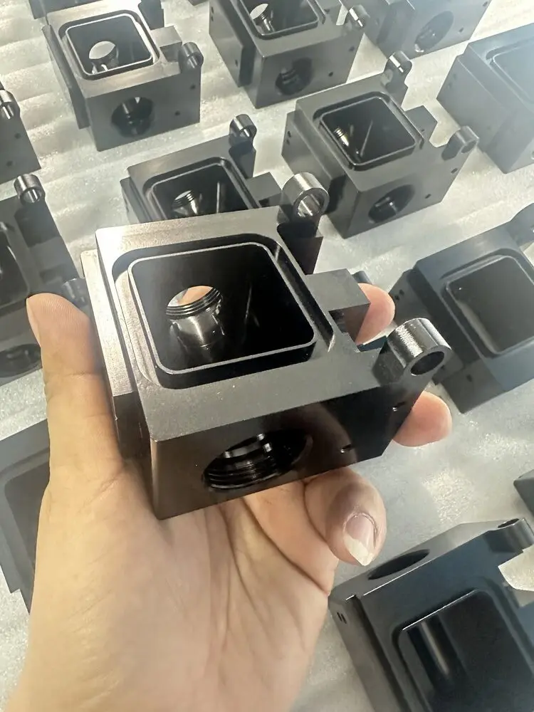 Close-up of finished black machined housing