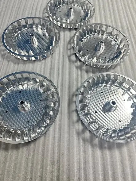 Five circular machined aluminum components